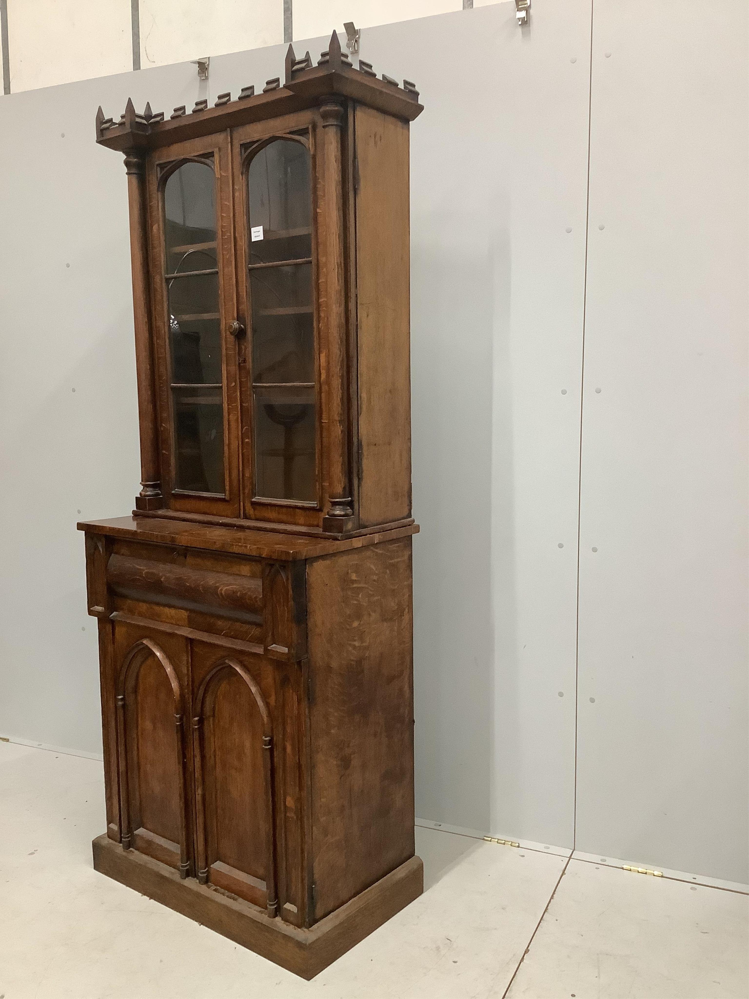 A William IV Gothic Revival oak secretaire bookcase, width 85cm, depth 47cm, height 209cm. Condition - poor to fair